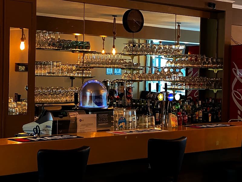 The bar counter lit up in the evening