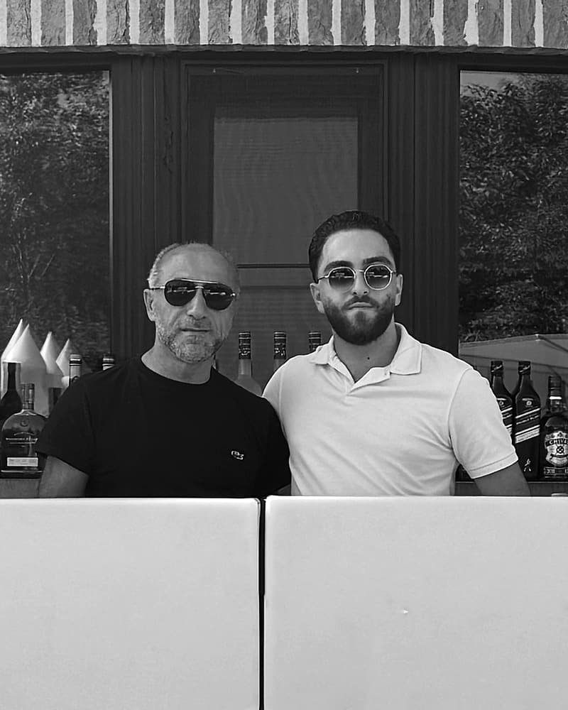 The owners of The New Break in front of their bar